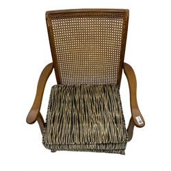 Mid-20th century beech armchair with cane back, upholstered seat with two cushions in striped fabric