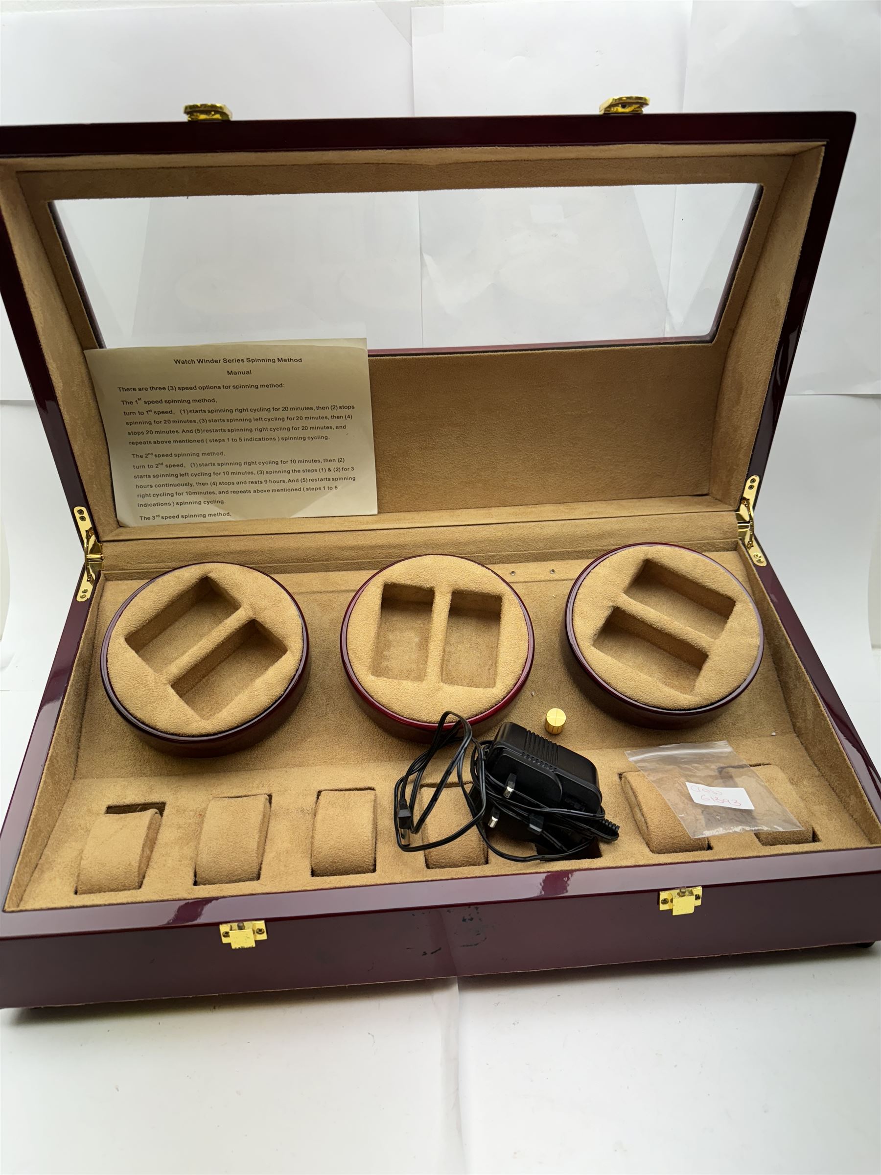 Electronic watch winder for three watches, in laminated mahogany finish, H24cm, W54cm