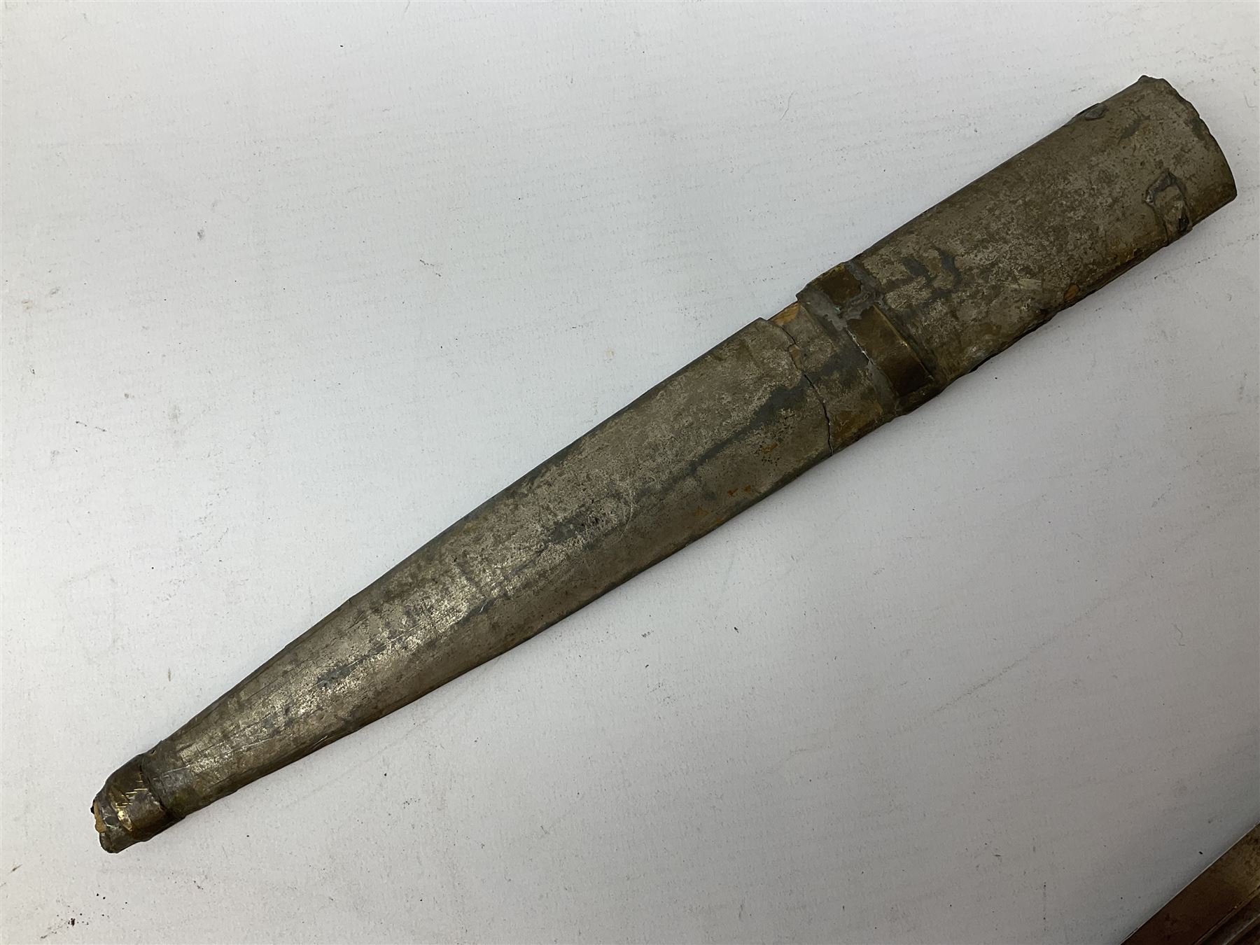 19th century Khanjali dagger, 33.5 cm double edged fullered blade with stamped makers marks, ornate cast grip, with engraved white metal scabbard, 46cm overall