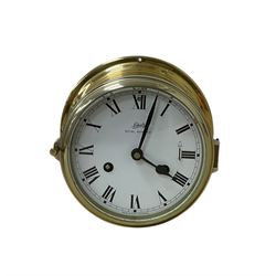 Schatz- 20th century Royal Mariner brass cased bulkhead mounted ships clock, twin train spring driven 8-day movement sounding the nautical watches on a bell, with a 5” dial, Roman numerals and spade hands. With key.  