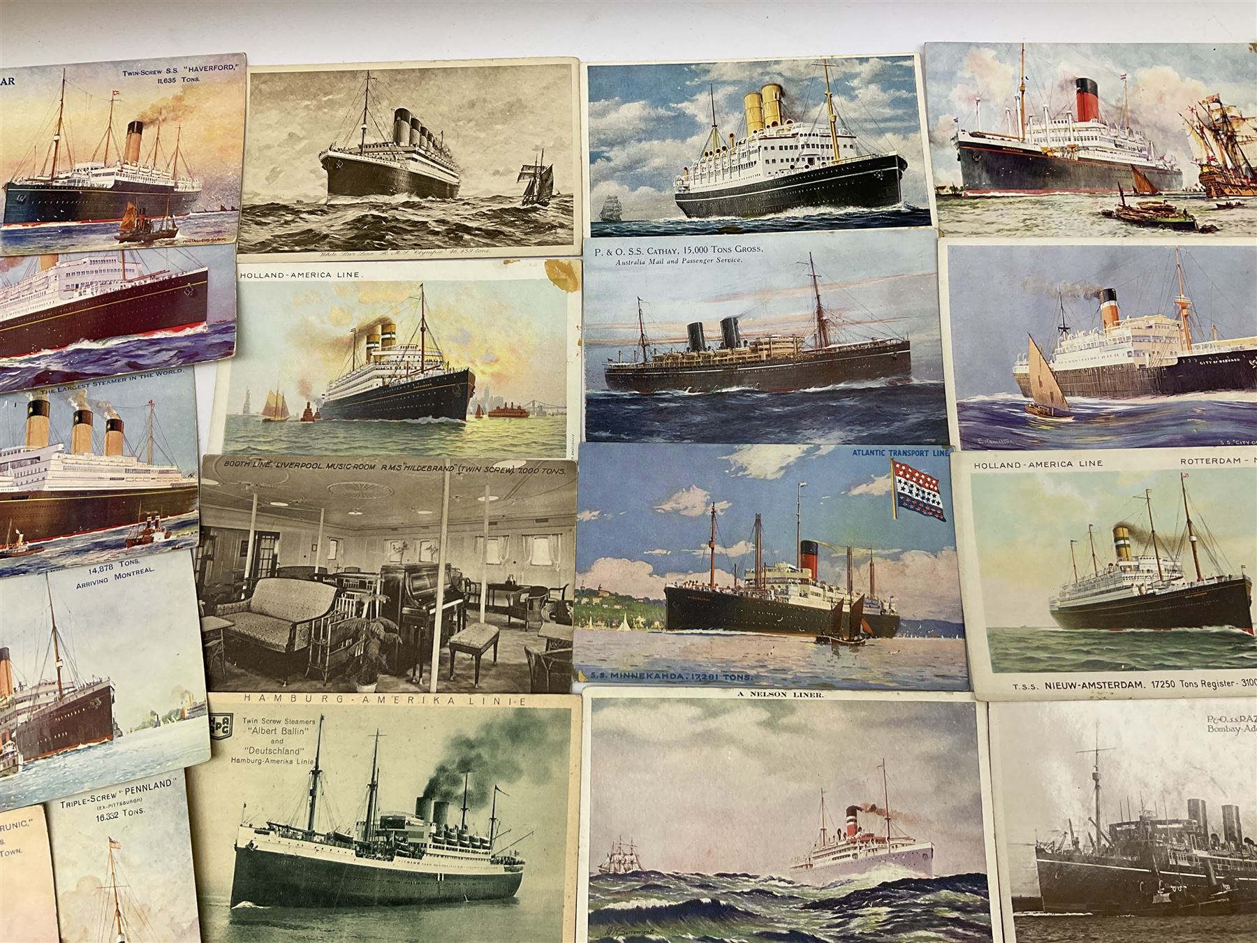 Sixty-five early 20th century postcards of passenger liners including White Star, Red Star, Atlantic Transport, Anchor, Cunard, Henderson, Booth, Union Castle, Holland America, Lamport & Holt, P. & O., New Zealand, Canadian Pacific, British India etc; and ten Edwardian postcards of Naval warships and officers (75)