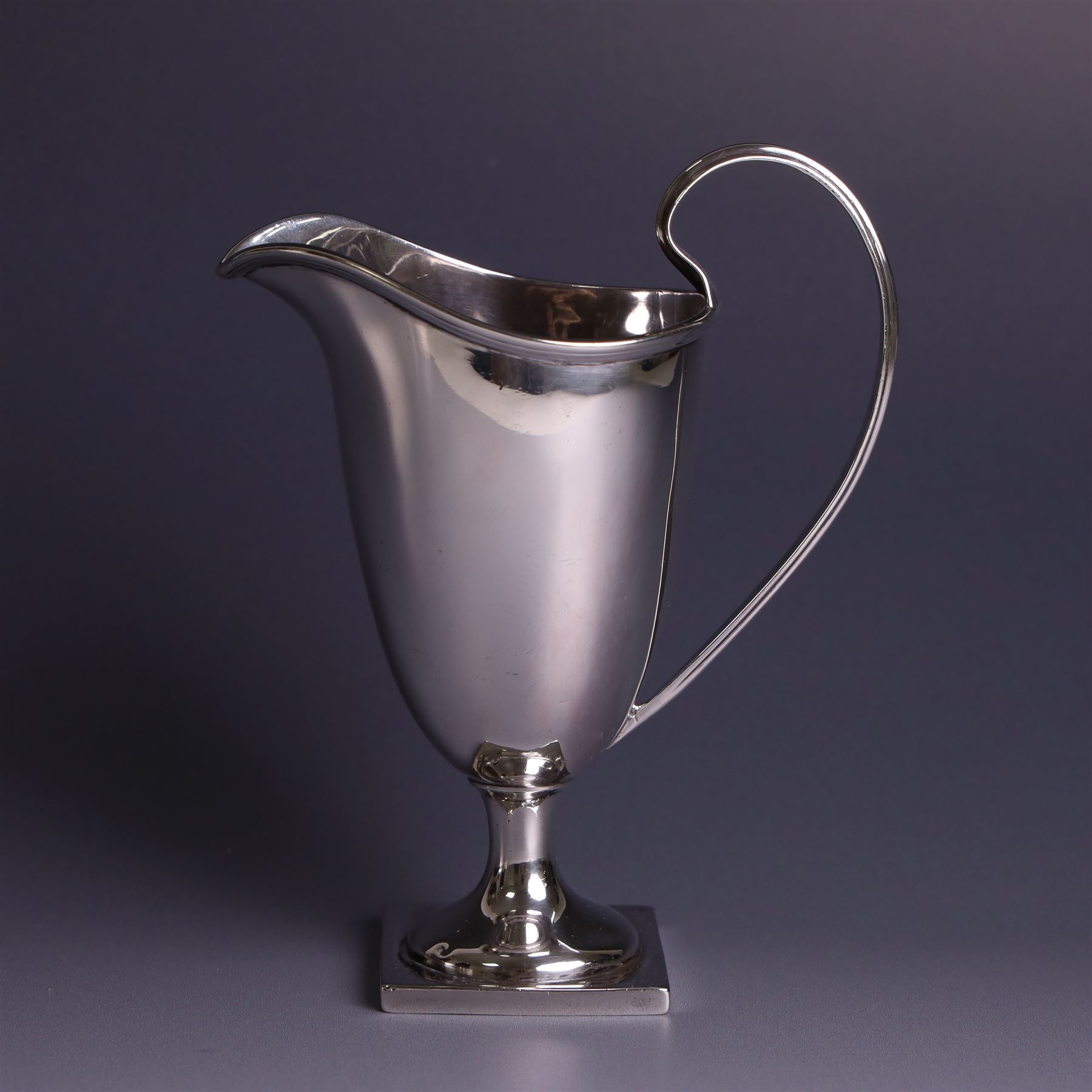 Edwardian silver helmet shaped cream jug, with plain bowl and upon a square base, hallmarked D & M Davis , Chester 1901, H13cm