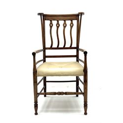 Early 20th century Arts and Crafts style fruitwood elbow chair, the C-scroll top rail with curving supports, pierced and wavy rail back, upholstered seat and turned front legs and stretcher H101cm W54cm D61cm