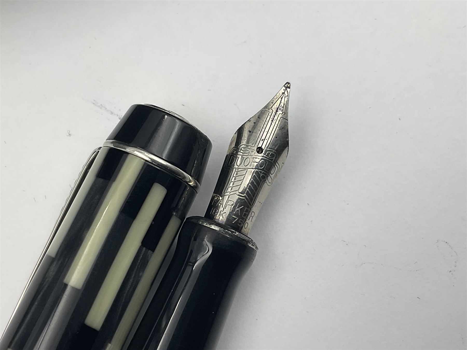 Parker Duofold Mosaic special edition fountain pen, issued in 2002, the black, pearl cream and grey cap barrel and cap with double bands and arrow clip, with gold nib stamped 18K 750, housed in original box and outer card packaging with booklet and wiping cloth