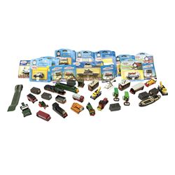 Ertl Thomas the Tank Engine and Friends die-cast models including carded Scrap Trevor, Slate Trucks, Neil, Wilbert, Sodor Taxi, Sodor Recovery Unit, Crane and four key rings; together with various uncarded models including locomotives, coal wagons, steam rollers, boat transporter, recovery units etc (over forty items)