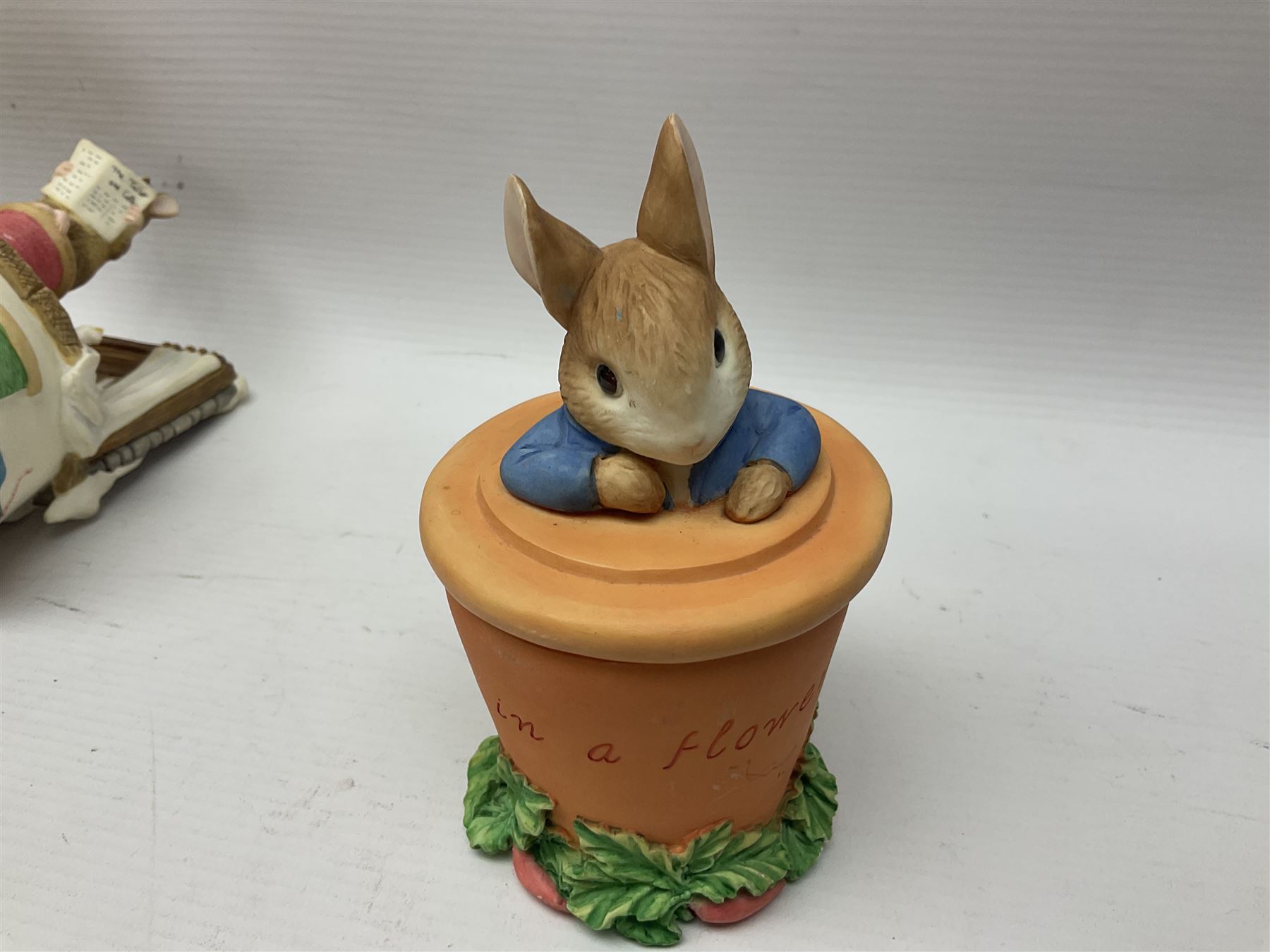 Twelve Border Fine Arts The World of Beatrix Potter and Peter Rabbit Collection figures, including Musical Tailor of Gloucester, Peter Rabbit with Miniature Waterball, Peter Hid in a Flowerpot trinket box, Jemima Puddle Duck with Herbs and Gentleman Mouse, etc
