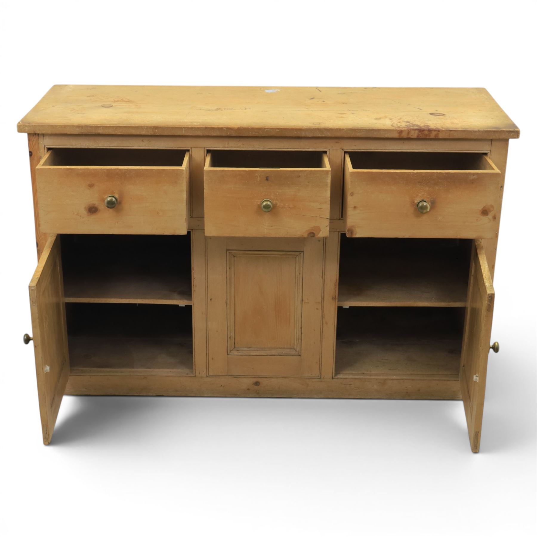 Victorian pine dresser base, with rectangular plank top, above three short drawers over two cupboard doors