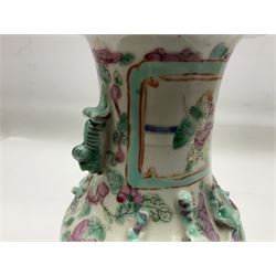 Chinese Canton Famille Rose vase, decorated in enamel with figural panels against floral and foliate ground, with dragon handles and lizard shoulders, H26cm