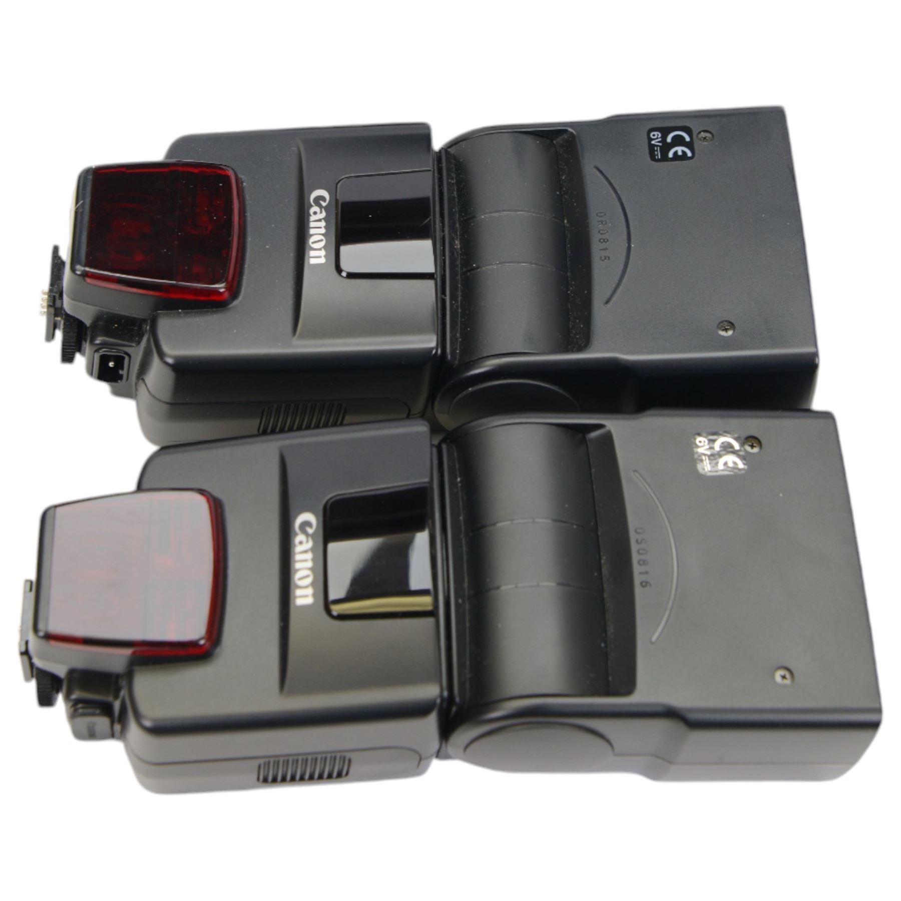 Collection of Canon camera lenses and accessories, including EF 50m 1:1.4 lens, EF 35mm 1:2 lensFD 28mm 1:2.8 lens, FD 50mm 1:1.8 lens, FD 135mm 1:2.5 S.C lens, FD35-70mm 1:3.5-4.5 lens, three Speedlite 550EX flashes, Transistor pack E, lens hoods, battery chargers, etc 