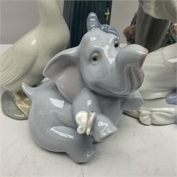 Two Lladro figures, Over the Threshold no 5282 and Prayful Moment no 5500 together with five Nao figures