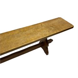 Gnomeman - adzed oak narrow bench, rectangular seat on shaped end supports united by pegged stretcher, carved with gnome signature, by Thomas Whittaker, Little Beck 