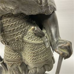 Pair of bronzed figure modelled as a hunter in traditional dress, each holding a pike, H48cm