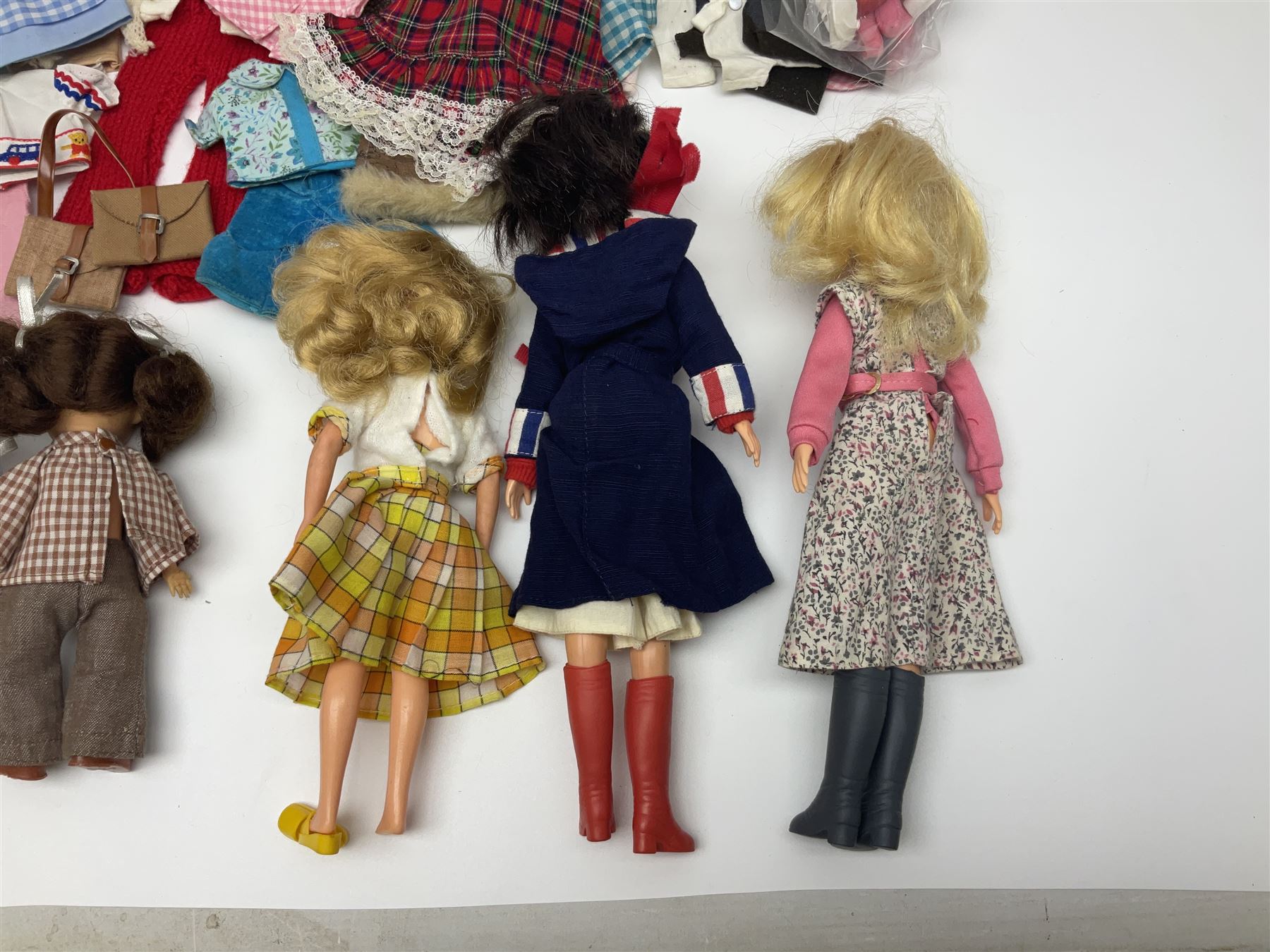 Six fashion dolls by Amanda Jane, Sindy and Barbie with various outfits, clothing and footwear