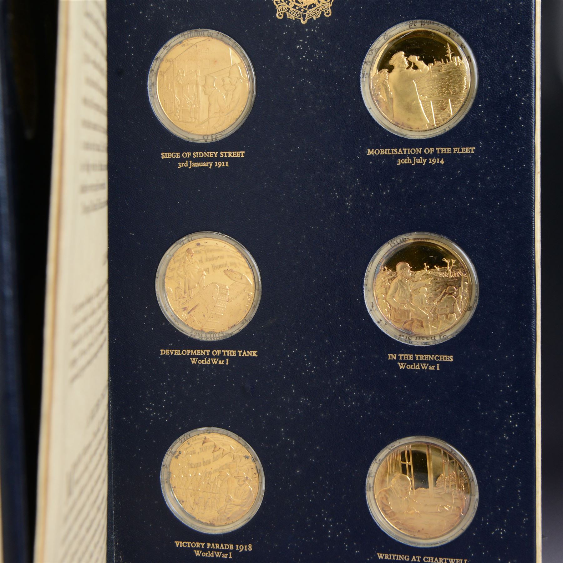 The Churchill Centenary Trust Medal Collection, 1974, a complete set of 24 silver-gilt medallions struck by John Pinches, issued by the Churchill Centenary Trust to commemorate the 100th anniversary of the birth of Winston Churchill; individually encapsulated with certificate of authenticity and housed in a leatherette display album