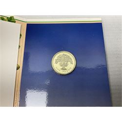 Two Great Britain and Northern Island proof sets dated 1970 and 1971, both with card cases, three 1986 Commonwealth Games commemorative two pound coins, in card folders, and six brilliant uncirculated one pound coins, in card folders