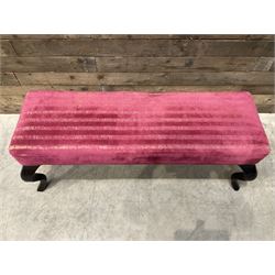 Large rectangular footstool upholstered in a maroon fabric with cabriole supports