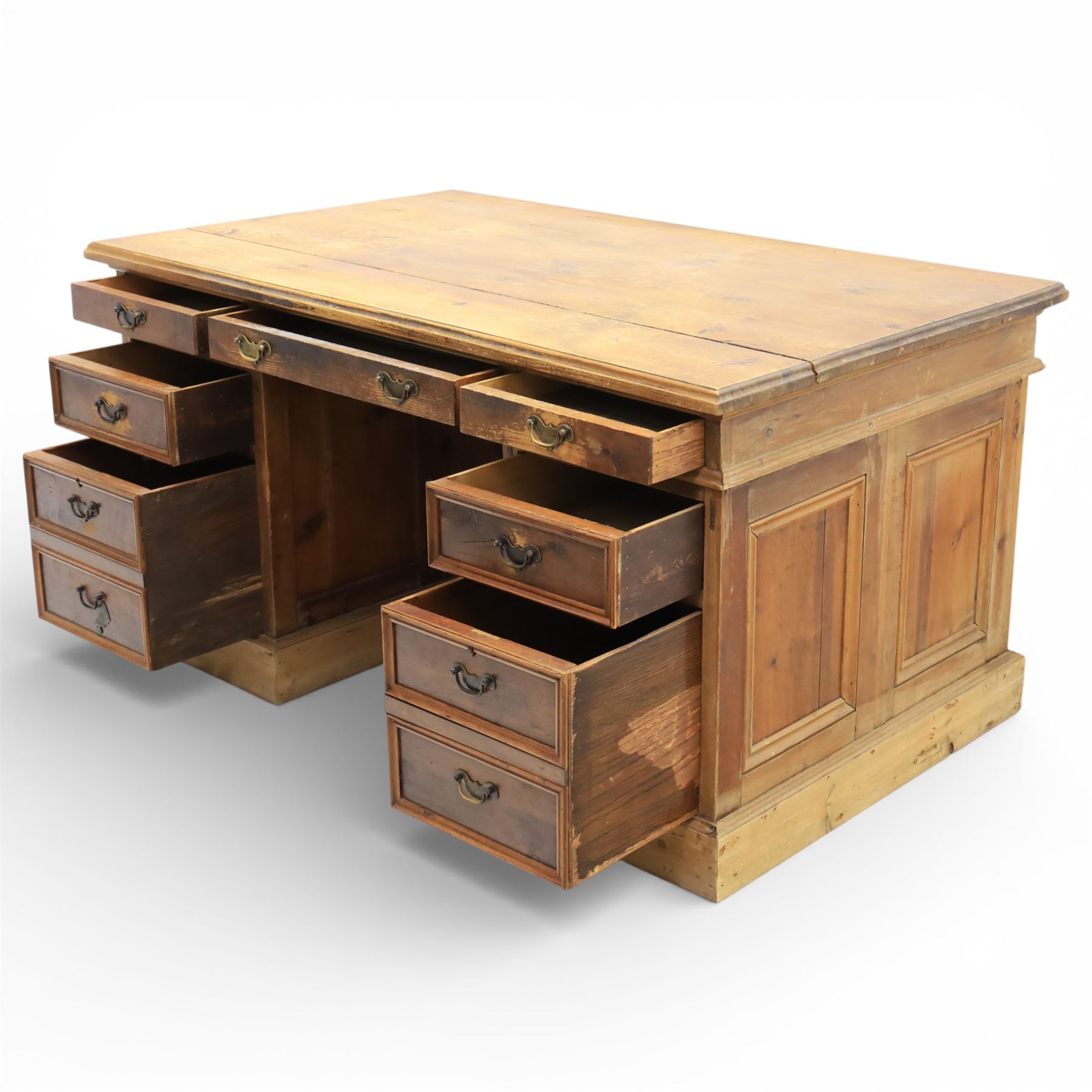 Late 19th century Victorian pine twin pedestal desk, rectangular plank top above an arrangement of seven drawers with brass swan neck handles, each pedestal fitted with one drawer above a double height drawer, raised on plinth bases with panelled sides