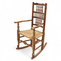 Lancashire elm rocking chair, shaped cresting rail over triple row bobbin turned spindles,...