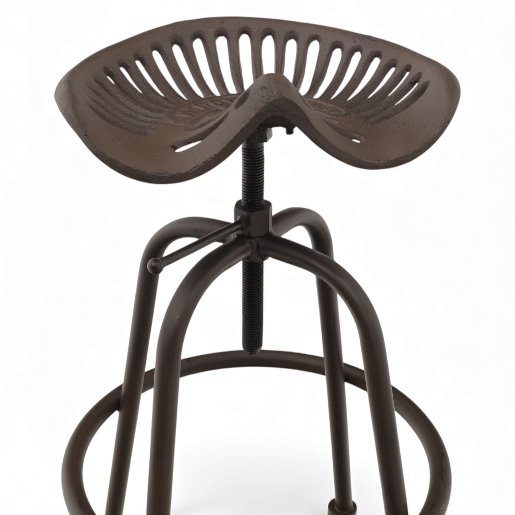 Industrial design pair of cast metal 'tractor seat' revolving bar stools, each with pierced tractor seat shaped top from the early 20th century, raised upon tubular steel supports with circular footrests (Height adjustable from 77cm - 93cm)