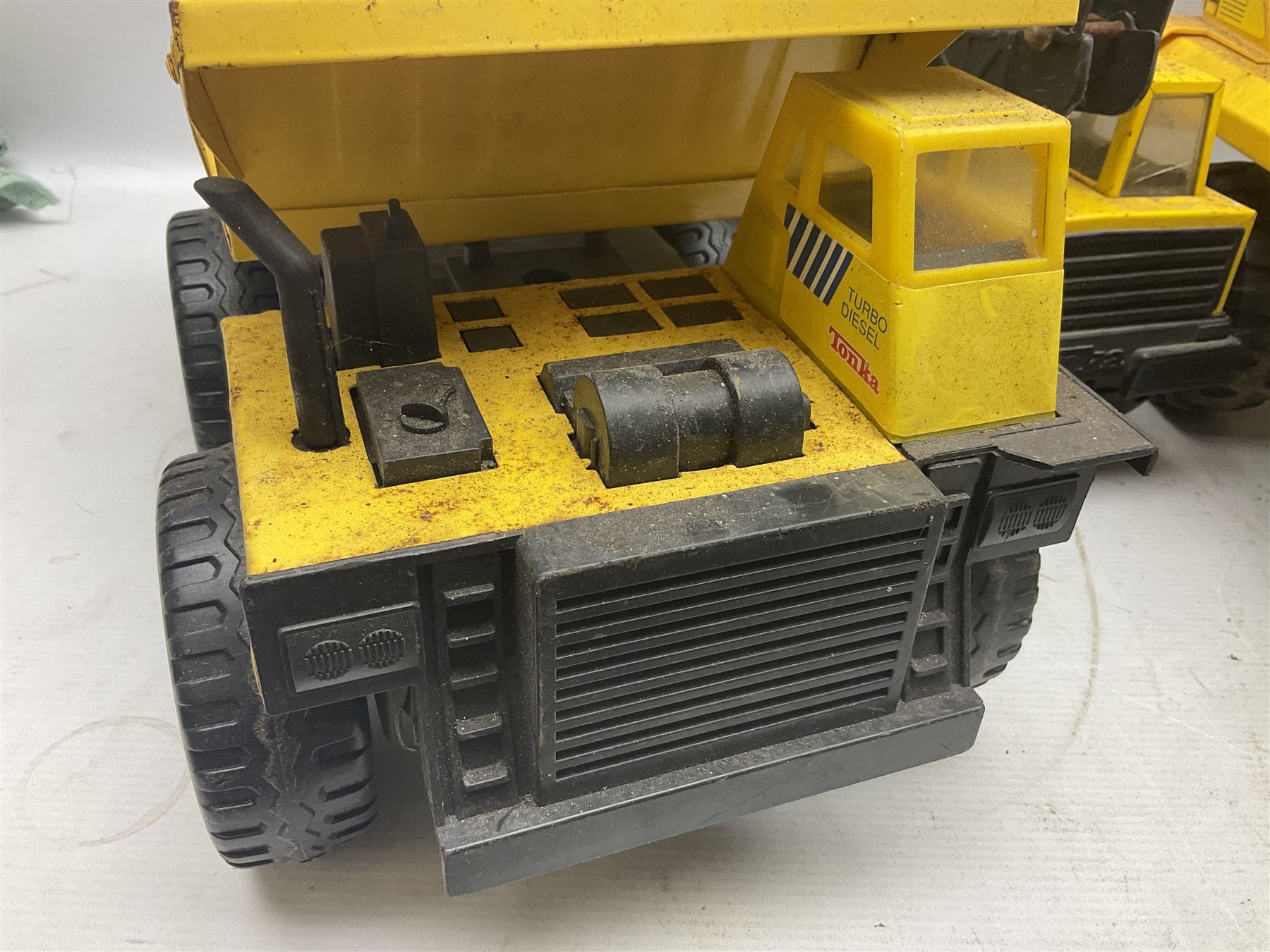 Tonka - five large scale pressed steel vehicles comprising Cement Mixer, Mobile Crane, Bulldozer and two Dumper Trucks (5)