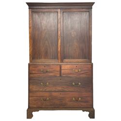 George III mahogany Gentleman's linen press, the projecting cornice over two panelled cupboard doors enclosing three sliding trays, the base fitted with two short over three long graduating cock-beaded drawers, lower moulded edge over bracket feet