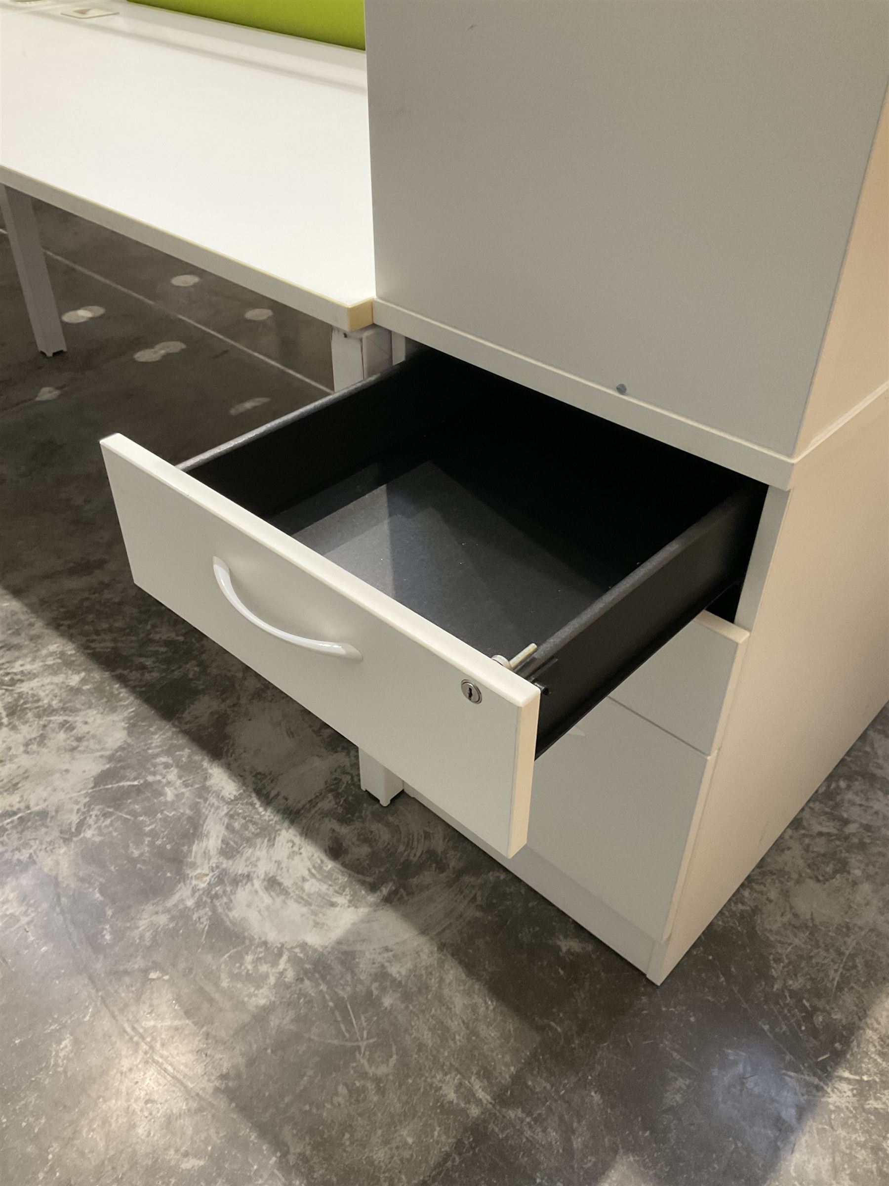 Modular two desk office system - comprising two desks, two returns, two filing drawer cabinets and one screen. Desk dimensions W160cm, D80cm, H73cm, pedestal dimensions W42cm, D80cm, H120cm - THIS LOT IS TO BE COLLECTED BY APPOINTMENT FROM DUGGLEBY STORAGE, GREAT HILL, EASTFIELD, SCARBOROUGH, YO11 3TX