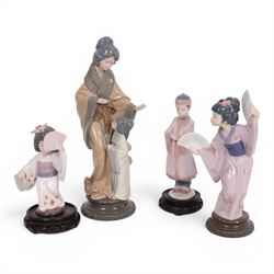 three Lladro figures, comprising Oriental Dancer 6230, Japanese with Fan 4991, Asian Boy 6...