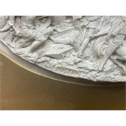 Justin Mathieu, two oval high relief plaque depicting a battle scenes, each within a wooden frame, frame  H21cm, L25cm