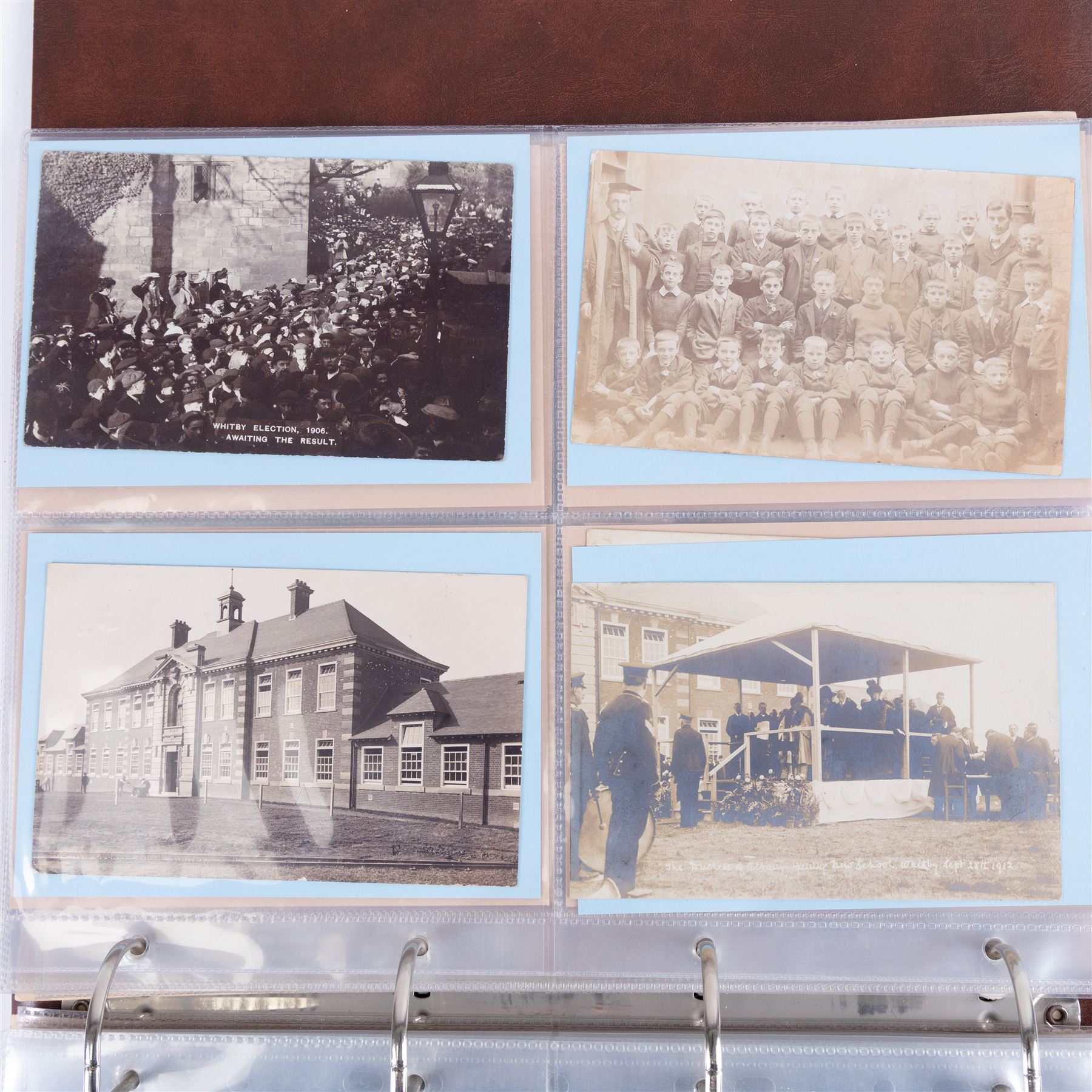 One-hundred and seventy two early 20th century Whitby view postcards, including a detailed collection documenting the destruction of Whitby following the bombardment by the German Fleet in 1914, a selection depicting the construction of the pier extensions, the opening of the new river drawbridge, a re-enactment of the medieval tradition of building the 'Penny Hedge' and the 1932 flooding of the town centre, together with a selection depicting social events at Spa, all housed within a Stanley Gibbons Picture Postcard Album