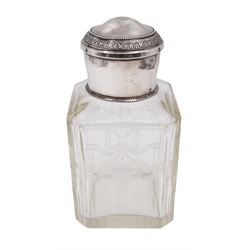 Early 20th century French silver mounted glass scent bottle, the faceted rectangular glass body etched with swags of flowers united by ribbons, with cylindrical silver cover embossed with foliate detail and beaded decoration with gilt interior, marked with Minerva's head, with white metal collar and glass stopper, H17cm