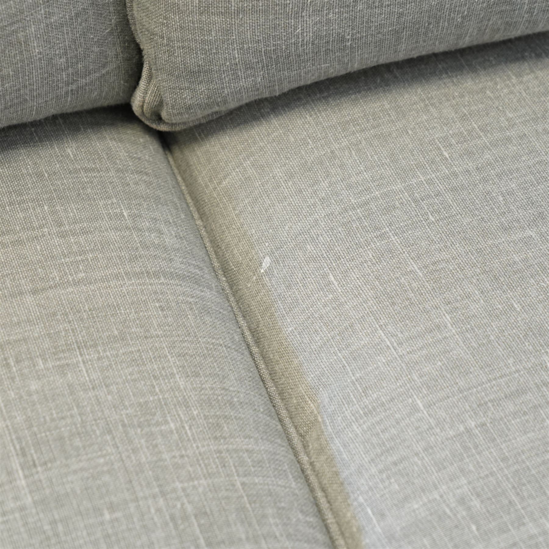 Neptune traditional style two-seat sofa, sloped back rest, gently flared arms, studded upholstered in a light grey fabric on square tapered legs 