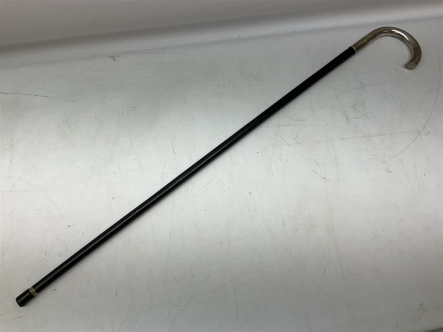 Continental silver handled walking cane, unmarked but testing around 800 standard, with engraved monogram to terminal, upon an ebonised cane, approximately H91.5cm