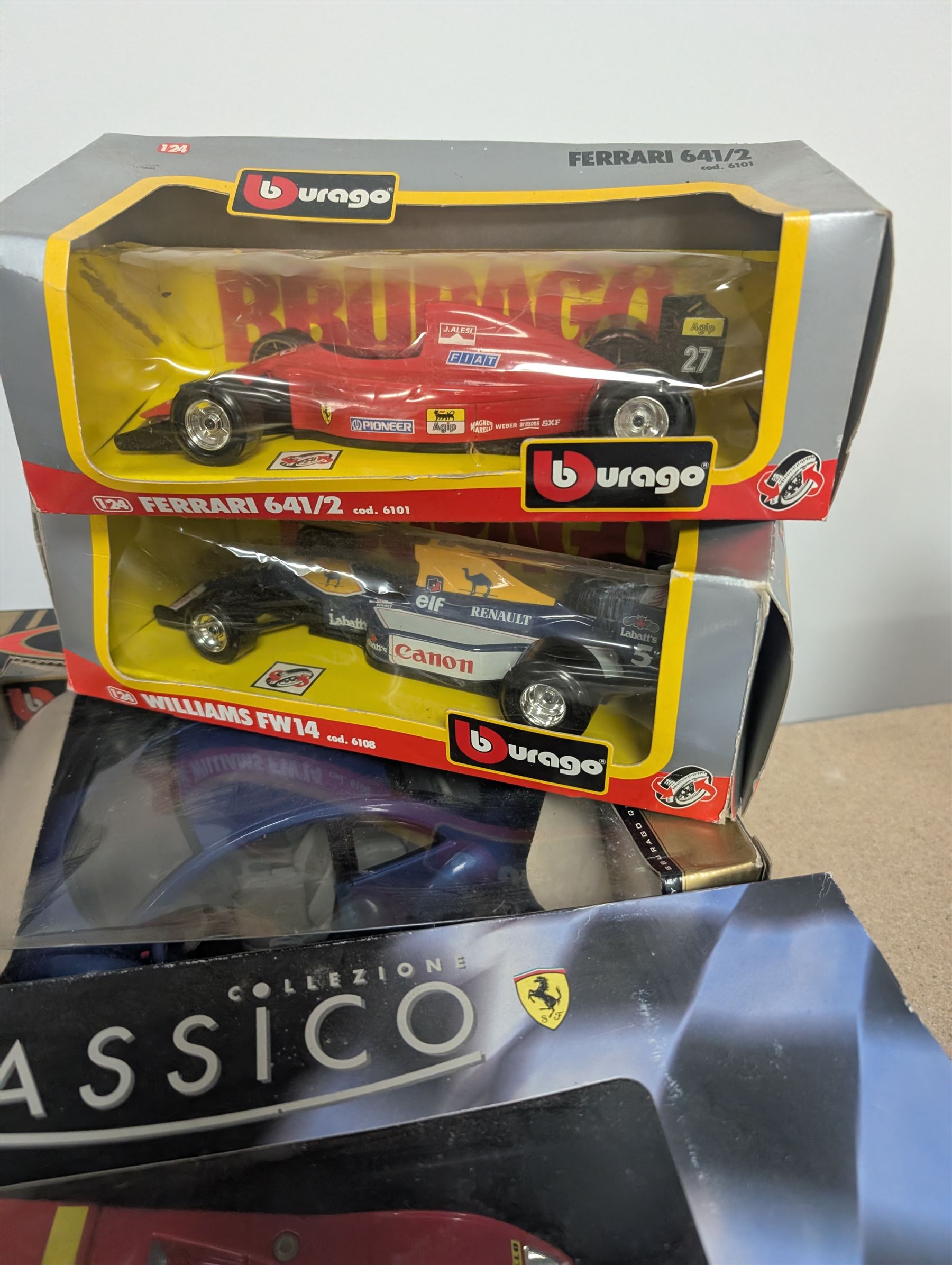Fourteen 1:18 and 1:24 scale diecast model vehicles, including Classico Ferrari 1972 312, DX RC Lamborghini Gallardo, Maisto Silver Edition Porsche Boxter, , Bburago Williams Fw14, Bburago Ferrari 641/2, etc all boxed