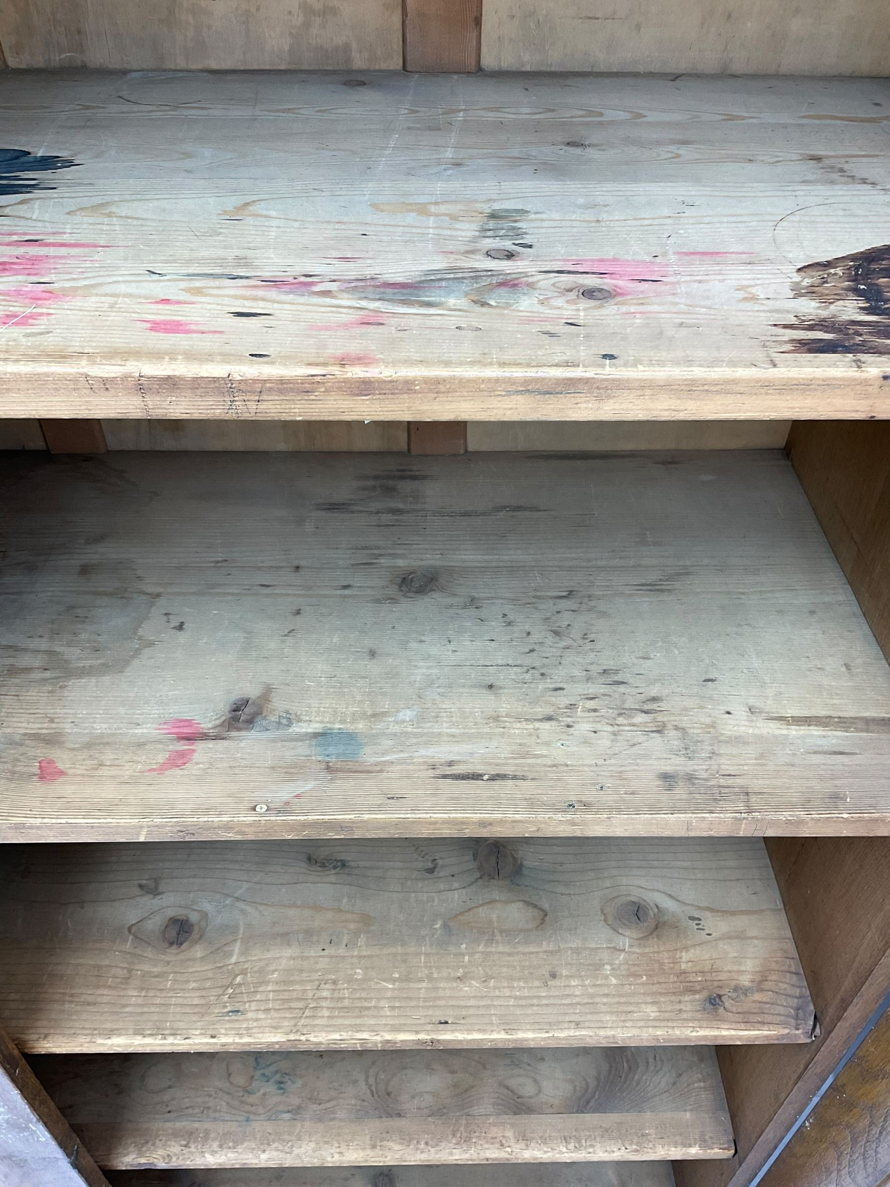 The North of England School Furnishing Company Limited Darlington - early 20th century oak school cupboard, projecting moulded cornice over two panelled doors, fitted with shelves, on chamfered plinth base 