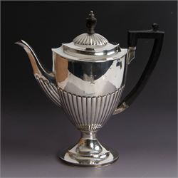 Victorian silver four piece tea service, comprising coffee pot, teapot, twin handled open sucrier and milk jug, all of oval part fluted form and engraved with initial to body, the coffee pot on oval stepped foot, coffee pot and teapot with ebonised wooden finials, hallmarked Elkington & Co, Birmingham 1888