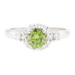 18ct white gold diamond cluster ring, the principal round brilliant cut fancy green diamon...