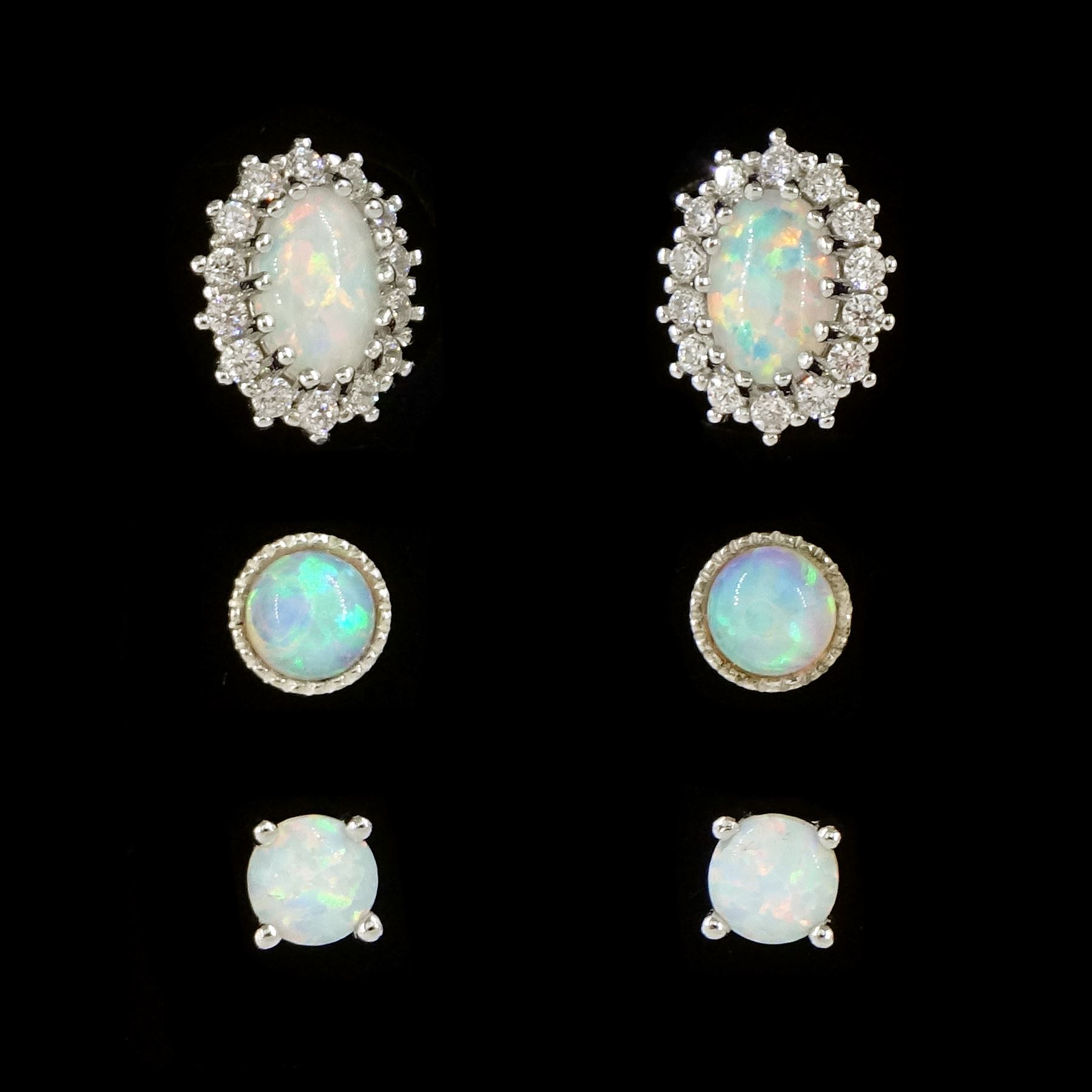 Pair of silver opal and cubic zirconia stud earrings and two other pairs of silver opal stud earrings