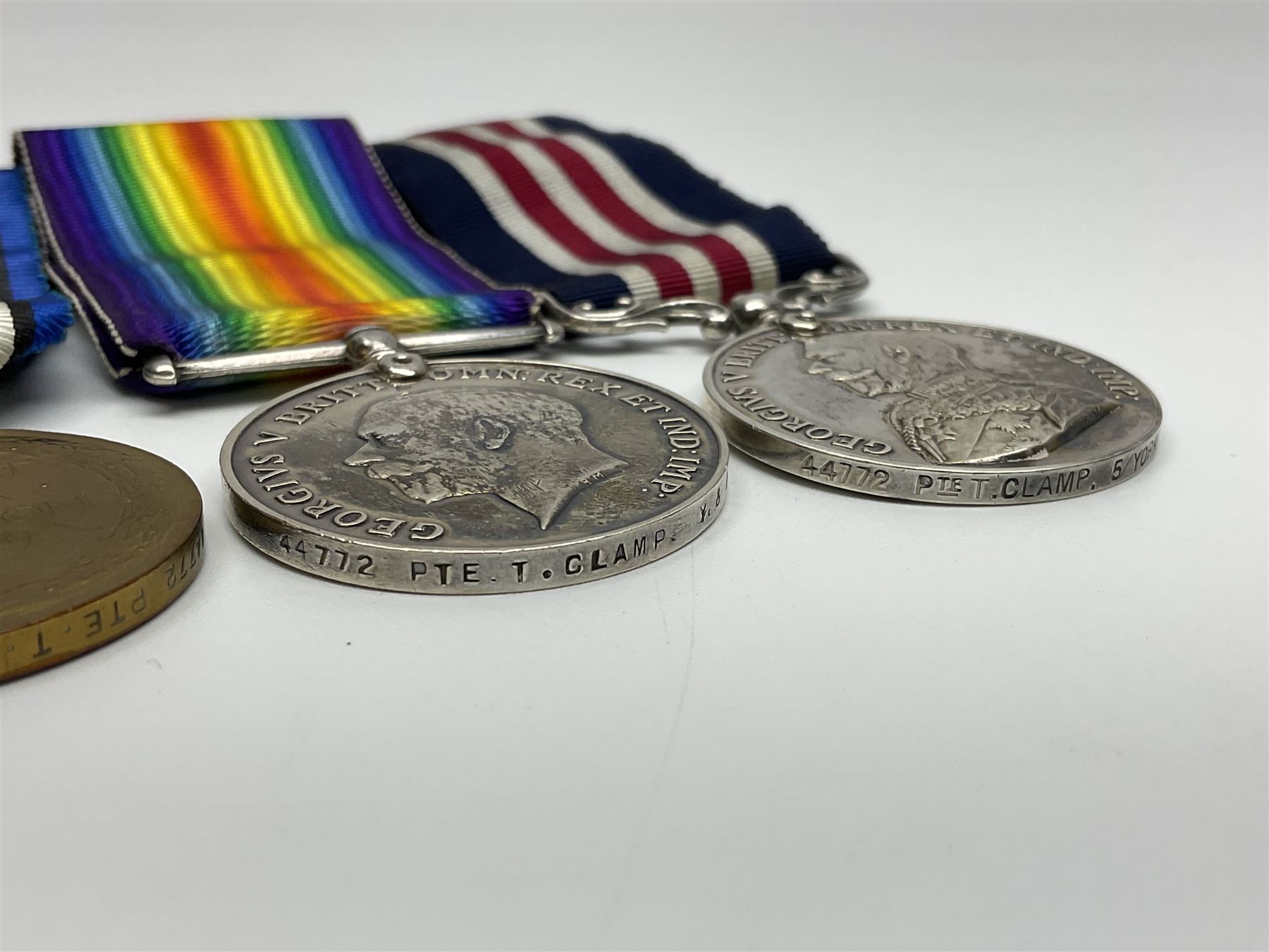 WW1 Military Medal group of three comprising MM, British War Medal and Victory Medal awarded to 44772 Pte. T. Clamp 5/York: & Lanc: R.; all with ribbons on hanging bar