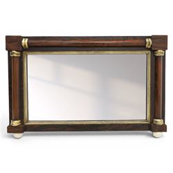 19th century brass and simulated rosewood mirror, with ceramic finials