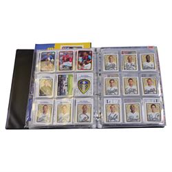 Collection of Football related stickers and albums, including Portugal Euro 2004 unused album and a collection of stickers,  Merlin The Official FA Premier League Sticker Collection 10th Edition 2003 unused album and stickers, Merlin The Official FA Premier League Sticker Collection 11th Edition 2004 unused album, Merlin The Official FA Premier League Sticker Collection 2001 unused album and stickers, Merlin The Official FA Premier League Sticker Collection 2002 unused album and stickers and Merlin's 2002 England unused album and stickers, housed in two folders