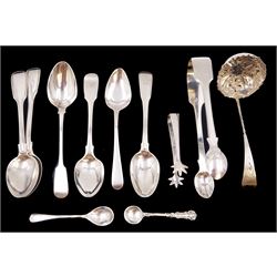 Group of silver flatware, to include Victorian silver sifting spoon, with bright cut engraving to twisted handle and repousse floral decoration to circular pierced bowl, hallmarked Thomas Hayes, Birmingham 1897, together with  pair of silver Fiddle pattern sugar tongs, hallmarked William M Traies, London 1826, a pair of Scottish silver sugar tongs, with bird claw bowls, hallmarked W H Collins & Co, Glasgow 1931, and a collection of Georgian and later silver spoons, all hallmarked with various dates and makers 