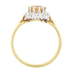 18ct gold imperial topaz and diamond cluster ring, oval cut topaz of approx 1.50 carat, surrounded by twelve round brilliant cut diamonds, London 1987, total diamond weight approx 0.10 carat