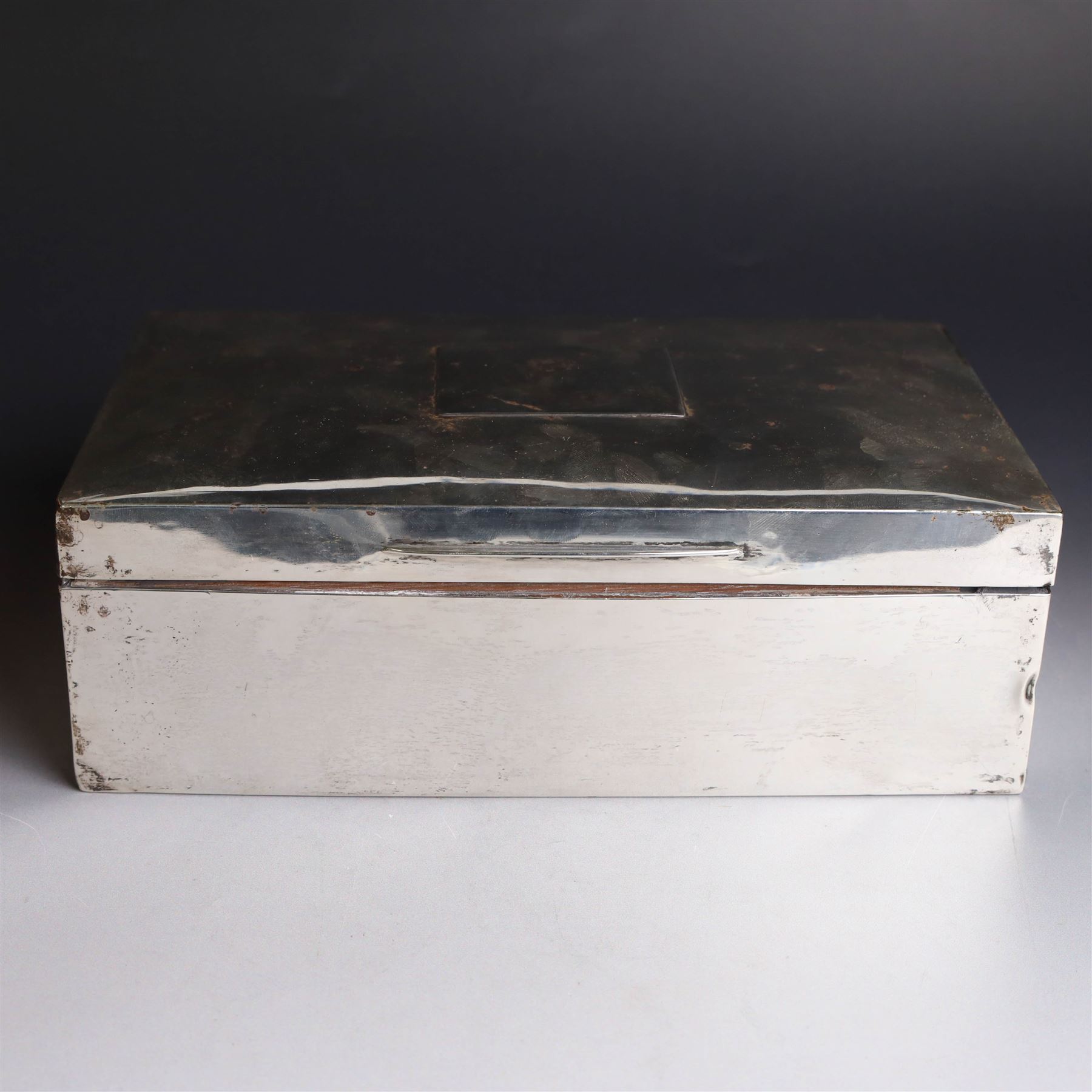 1920s silver mounted cigar box, of rectangular form with later applied vacant rectangular cartouche to hinged cover, opening to reveal compartmentalised softwood interior, hallmarked London 1923, makers mark worn and indistinct, H7cm, W22cm