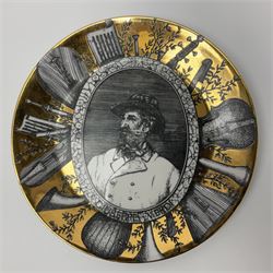 Fornasetti Grandi Maestri plate, depicting Giuseppe Verdi within a border of operatic emblems on gilt ground, with printed mark beneath, D25cm