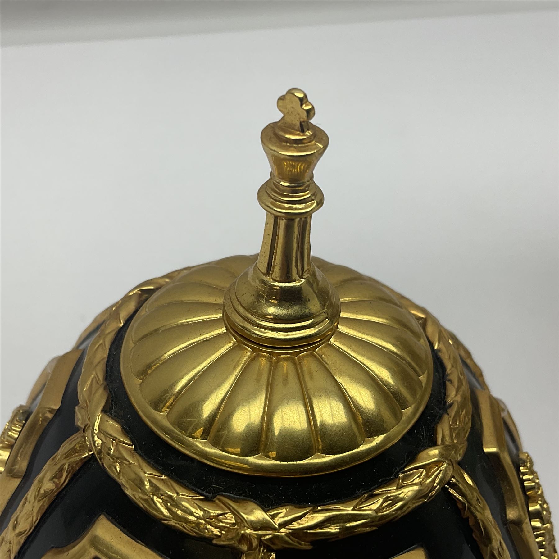 Franklin Mint House of Faberge; The Imperial Jeweled Egg Chess set, the egg opening to reveal a chess board, with a draw to the hexagonal base holding the miniature chess pieces, H23cm 