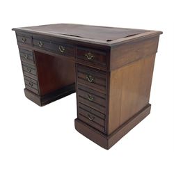 Edwardian mahogany twin pedestal desk, fitted with nine drawers