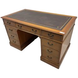 Cherrywood twin pedestal desk, rectangular leather inset top over central fall front with keyboard slide and two drawers, fitted with two drawers and cupboard, on bracket feet