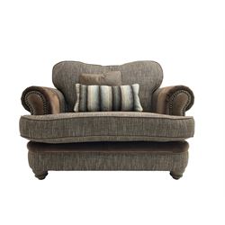 'Canterbury' snuggler sofa upholstered in brown fabric with contrasting textures, traditional shape with scrolled arms and studded bands, on turned feet