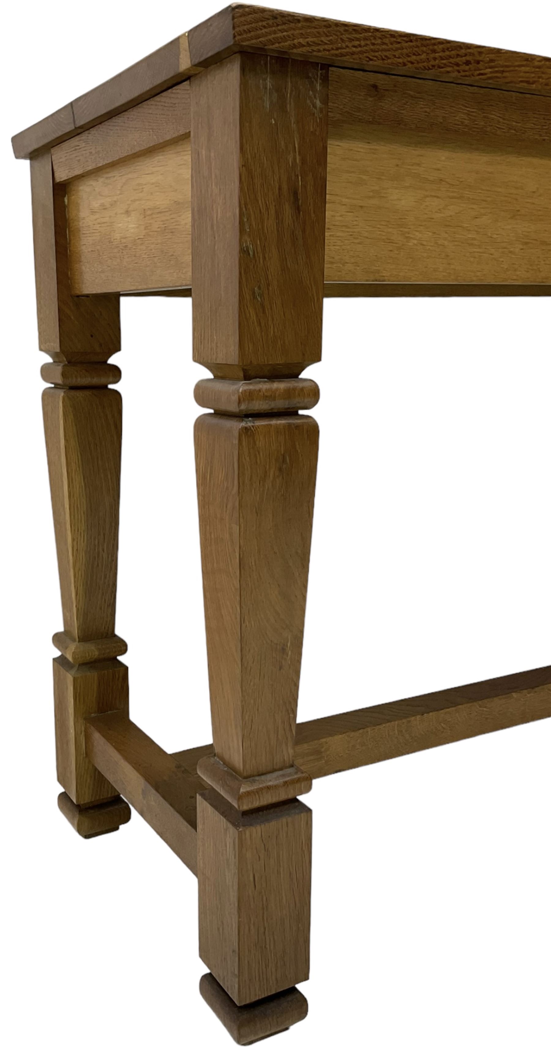 Solid oak console table, rectangular top raised on turned square supports united by stretcher