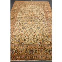  Persian Kashan pale yellow ground rug, central geometric medallion, 410cm x 270cm  